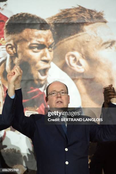 Prince Albert II of Monaco stands on stage on May 21, 2017 in Monaco, during a celebration to mark the club winning their first French Ligue 1 title...