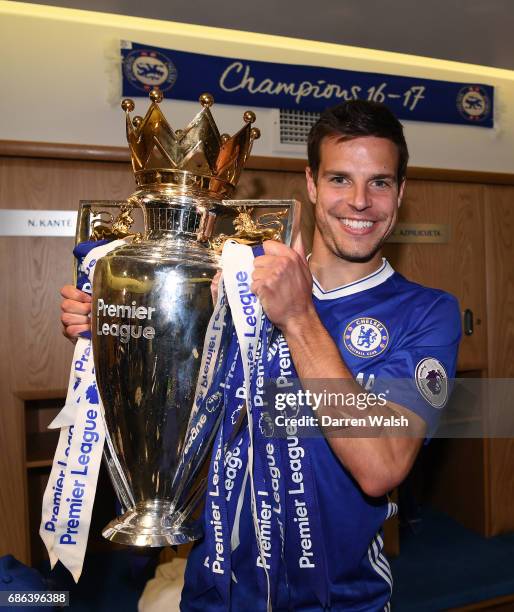 Cesar Azpilicueta of Chelsea poses with the Premier League Trophy in the changing room after the Premier League match between Chelsea and Sunderland...