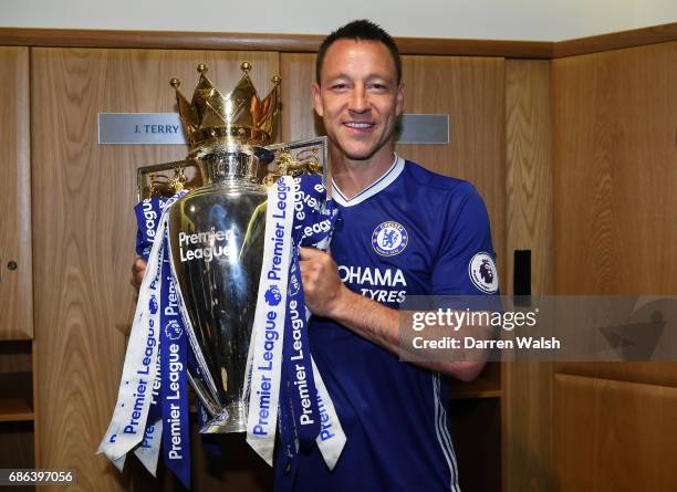 John Terry of Chelsea poses with the Premier League Trophy after the Premier League match between Chelsea and Sunderland at Stamford Bridge on May...