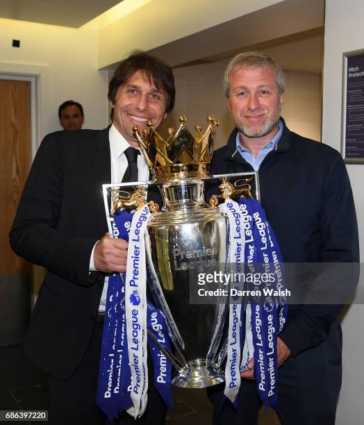 Antonio Conte, Manager of Chelsea and Roman Abramovich, Chelsea owner pose with the Premier League Trophy in the changing room after the Premier...