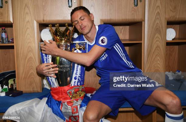 Nemanja Matic of Chelsa poses with the Premier League Trophy after the Premier League match between Chelsea and Sunderland at Stamford Bridge on May...