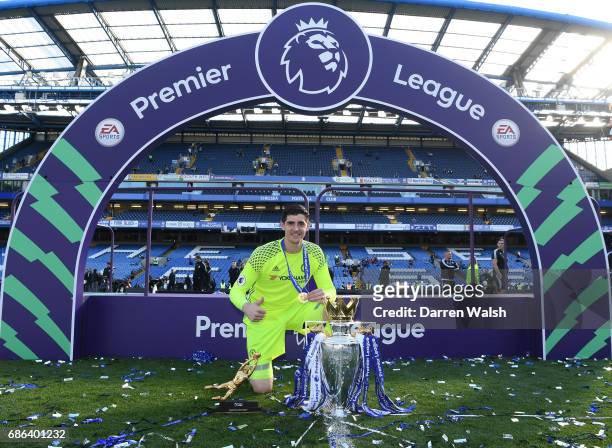 Thibaut Courtois of Chelsea poses with the Premier League Trophy and the Golden Glove after the Premier League match between Chelsea and Sunderland...