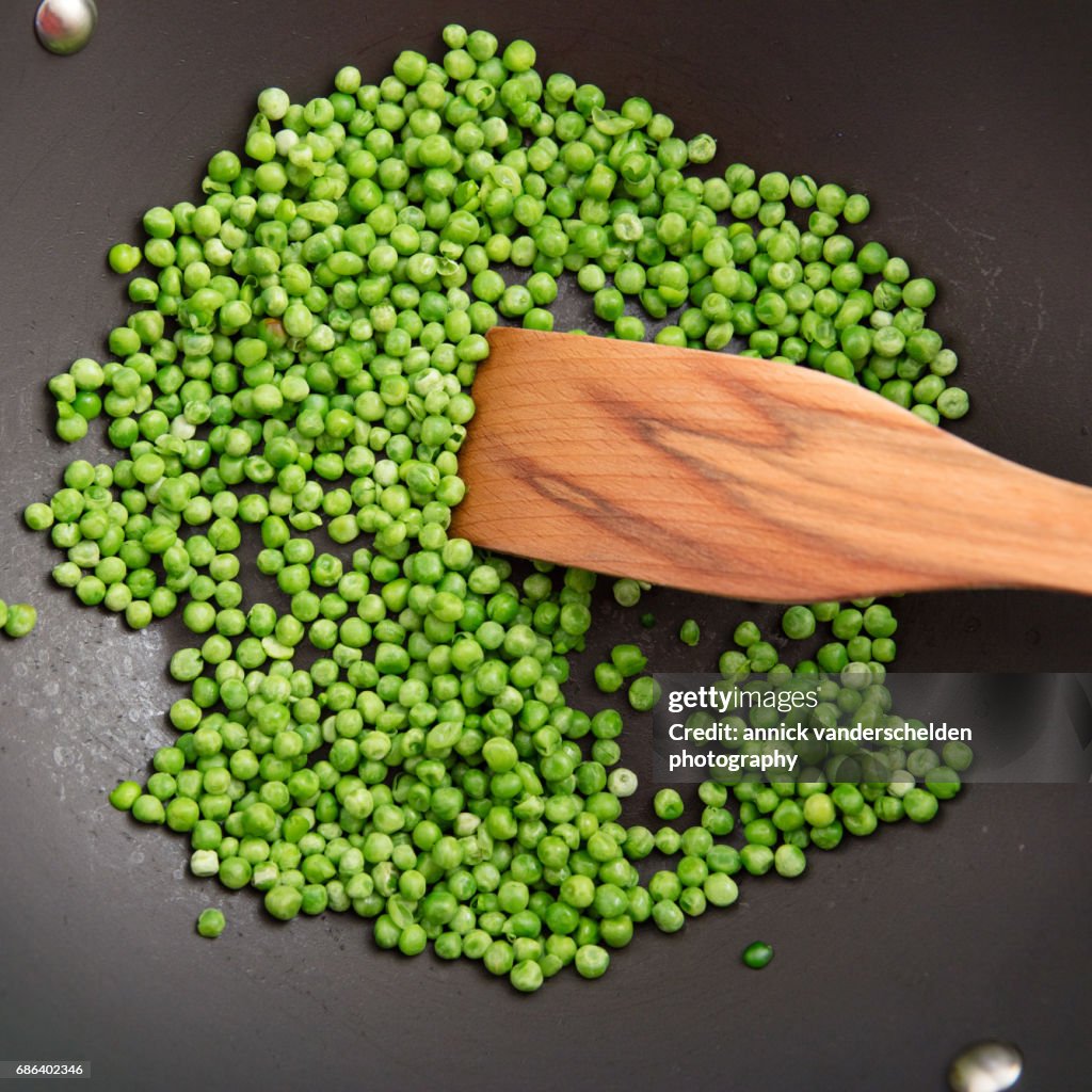 Peas in cooking pan.