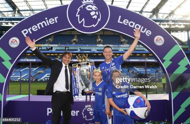 Antonio Conte, Manager of Chelsea, John Terry of Chelsea and his two children Georgie John and Summer Rose Terry pose with the Premier League Trophy...