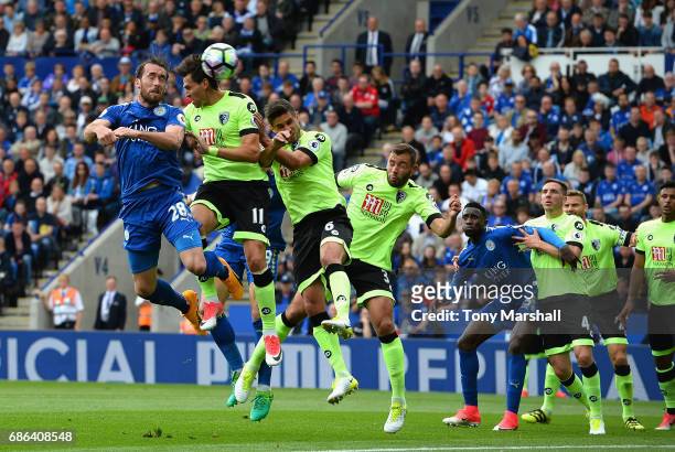 Christian Fuchs of Leicester City and Charlie Daniels of AFC Bournemouth battle to win a header during the Premier League match between Leicester...