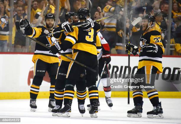 Olli Maatta of the Pittsburgh Penguins celebrates with his teammates after scoring a goal against Craig Anderson of the Ottawa Senators during the...