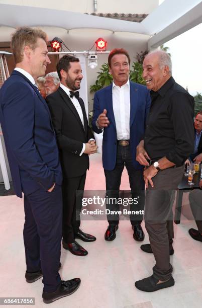 Guest, Michael Kives, Arnold Schwarzenegger and David Reuben attend a dinner hosted by Jamie Reuben & Michael Kives with Arnold Schwarzenegger to...