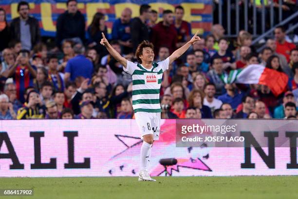Eibar's Japanese midfielder Takashi Inui celebrates his goal during the Spanish league football match FC Barcelona vs SD Eibar at the Camp Nou...