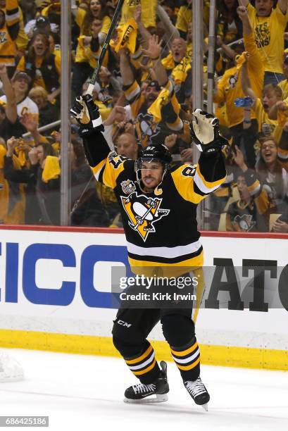 Sidney Crosby of the Pittsburgh Penguins celebrates with his teammates after scoring a goal against Craig Anderson of the Ottawa Senators during the...