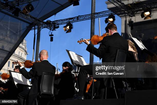 The London Symphony Orchestra gives a free, open-air concert to a crowd of thousands in London's Trafalgar Square, in an annual concert series...