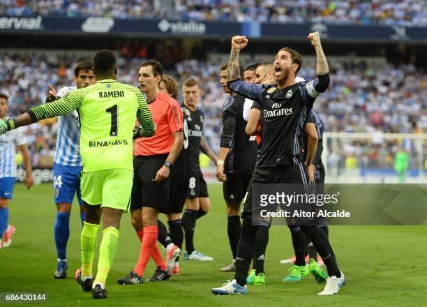 Sergio Ramos of Real Madrid celebrates with team mates after Karim Benzema of Real Madrid scores his sides second goal during the La Liga match...