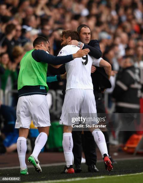 Swansea player Fernando Llorente celebrates his and the winning goal with Jordi Amat and head coach Paul Clement during the Premier League match...