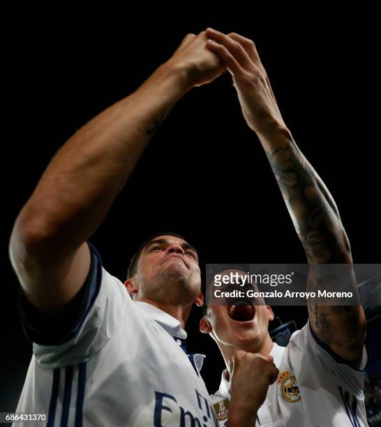 Pepe and James Rodriguez of Real Madrid take a selfie in celebration as they are crowned champions following the La Liga match between Malaga and...