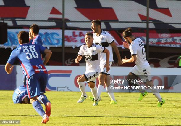Olimpia's players celebrates after scoring against Cerro Porteno during their Paraguayan Apertura 2017 tournament match at the Defensores del Chaco...