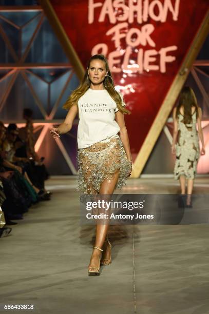 Heidi Klum walks the runway at the Fashion for Relief event during the 70th annual Cannes Film Festival at Aeroport Cannes Mandelieu on May 21, 2017...