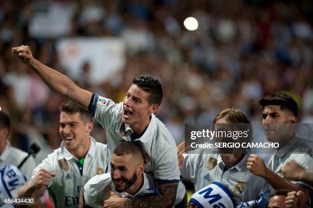 Real Madrid players celebrate winning the Liga title after the Spanish league football match Malaga CF vs Real Madrid CF at La Rosaleda stadium in...