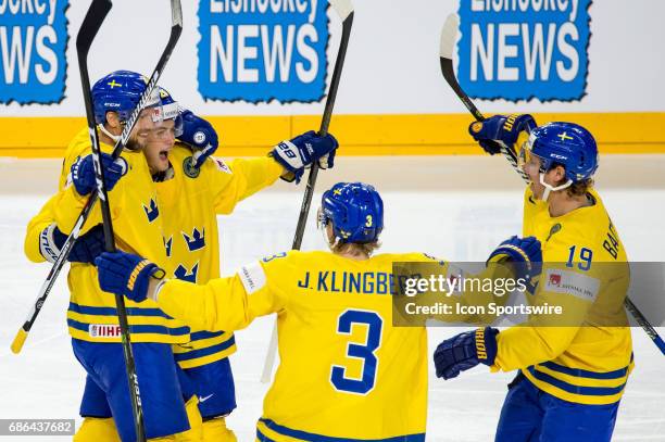 Alexander Edler celebrates his goal with teammates during the Ice Hockey World Championship Semifinal between Sweden and Finland at Lanxess Arena in...