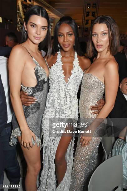 Kendall Jenner, Naomi Campbell and Bella Hadid attend the Fashion for Relief gala dinner during the 70th annual Cannes Film Festival at Aeroport...