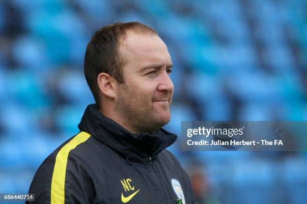 Nick Cushing, the manager of Manchester City Women, watches a warm up session before the WSL Spring Series Match between Manchester City Women and...