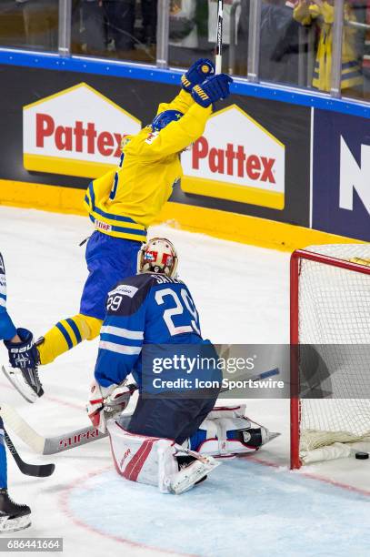 Marcus Kruger celebrates a goal from Joakim Nordstrom in the net of Goalie Harri Sateri during the Ice Hockey World Championship Semifinal between...