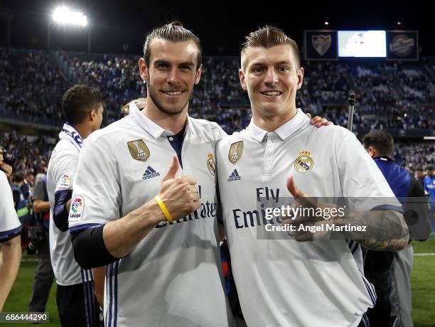 Gareth Bale and Toni Kroos of Real Madrid celebrate winning the La Liga title following the La Liga match between Malaga CF and Real Madrid CF at...