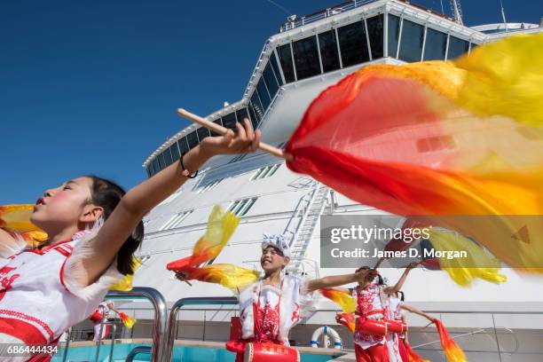 Girls and boys from the Luochuan Yangko dance troupe and Ansai waist drum troupe, Yan'an city, Shaanxi province, China performing aboard Princess...