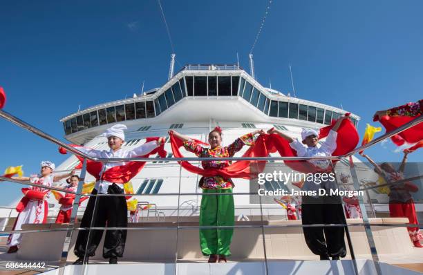 Girls and boys from the Luochuan Yangko dance troupe and Ansai waist drum troupe, Yan'an city, Shaanxi province, China performing aboard Princess...