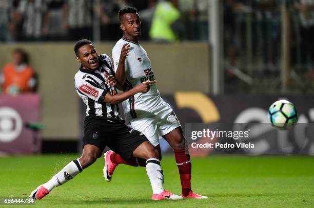 Elias of Atletico MG and Orejuela of Fluminense battle for the ball during a match between Atletico MG and Fluminense as part of Brasileirao Series A...