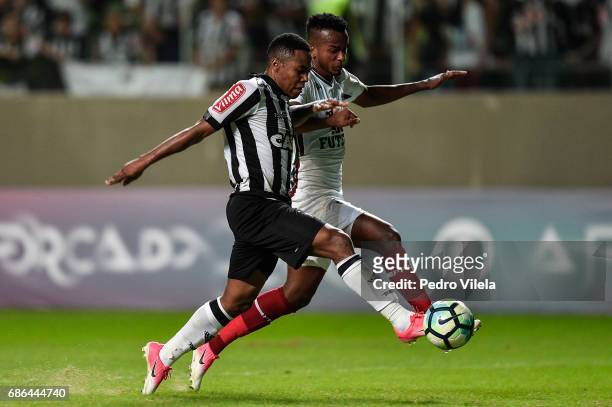 Elias of Atletico MG and Orejuela of Fluminense battle for the ball during a match between Atletico MG and Fluminense as part of Brasileirao Series A...