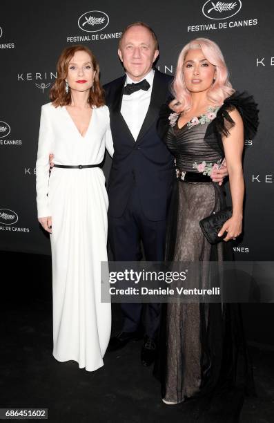 Isabelle Huppert, Francois-Henri Pinault and Salma Hayek attend the Women in Motion Awards Dinner at the 70th Cannes Film Festival at Place de la...