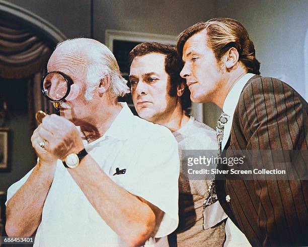 From left to right, Laurence Naismith as Judge Fulton, Tony Curtis as Danny Wilde and Roger Moore as Lord Brett Sinclair in 'The Gold Napoleon', the...