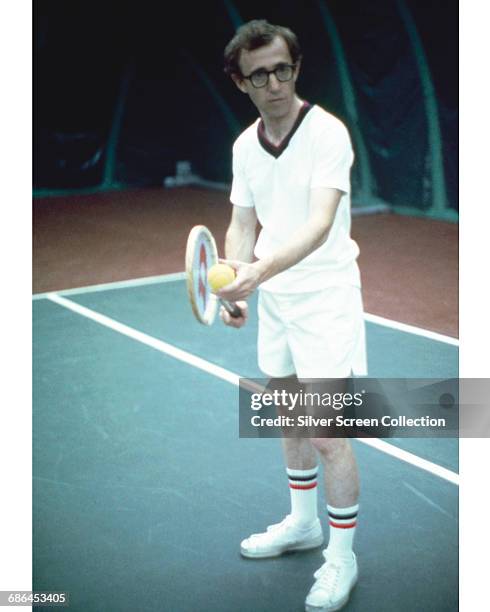 American actor, director, writer and comedian Woody Allen playing tennis in a scene from the film 'Annie Hall', 1977.