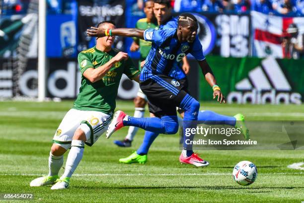 Montreal Impact defender Ambroise Oyongo jumping in the air while running after the ball during the Portland Timbers versus the Montreal Impact game...