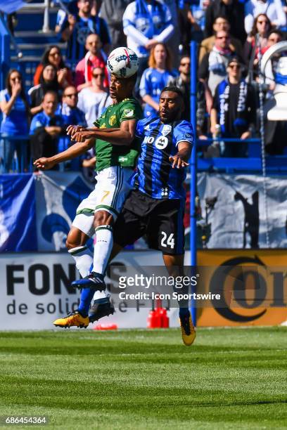 Montreal Impact forward Anthony Jackson-Hamel and Portland Timbers defender Roy Miller jumping in the air hitting the ball during the Portland...