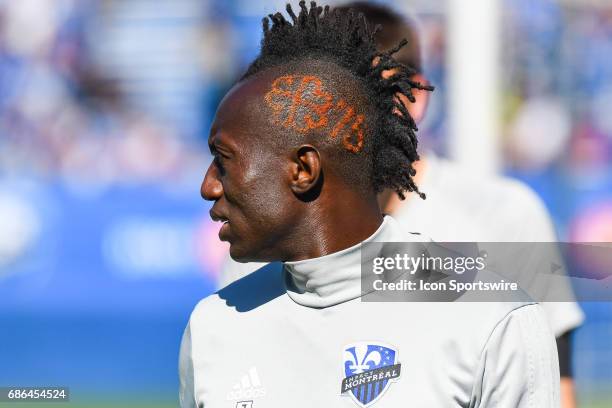 Look on Montreal Impact forward Dominic Oduro warming up on the side lines showcasing his Montreal 375th birthday special haircut during the Portland...