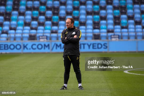 Nick Cushing, the manager of Manchester City Women, watches a warm up session before the WSL Spring Series Match between Manchester City Women and...