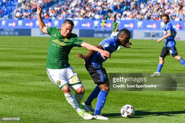 Portland Timbers midfielder David Guzman getting in contact with Montreal Impact midfielder Ballou Tabla during the Portland Timbers versus the...