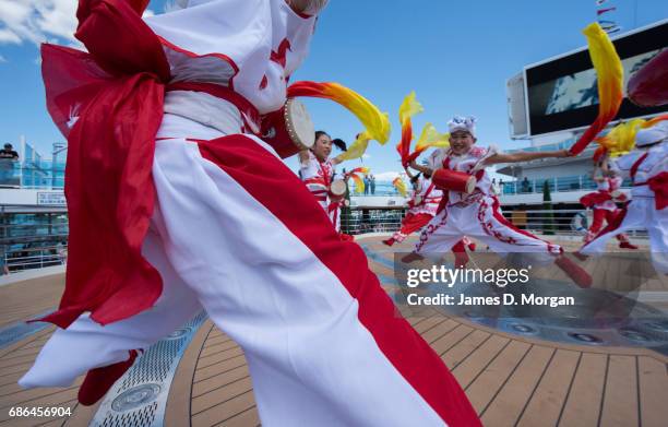 Girls and boys from the Luochuan Yangko dance troupe and Ansai waist drum troupe, Yan'an city, Shaanxi province, China performing aboard Princess...