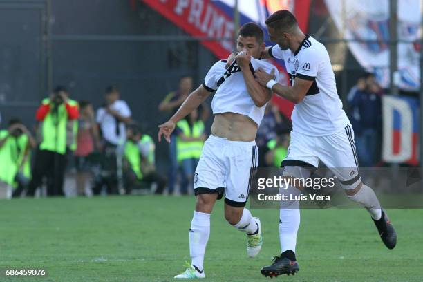 Richard Sanchez of Olimpia celebrates with teammate Hernan Pellerano after scoring the first goal of his team during a match between Olimpia and...