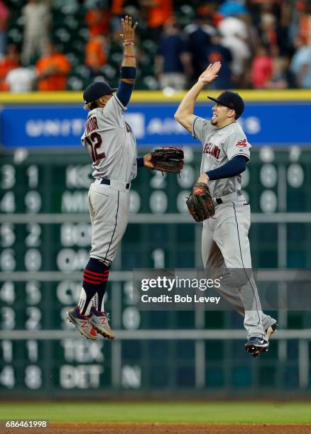 Francisco Lindor of the Cleveland Indians and Bradley Zimmer high five after beating the Houston Astros at Minute Maid Park on May 21, 2017 in...