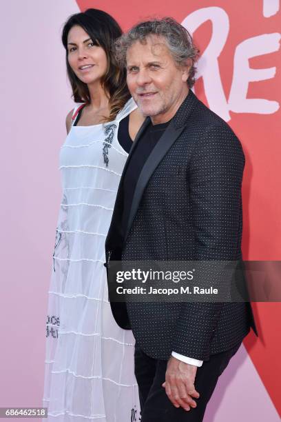 Renzo Rosso and Arianna Alessi attends Fashion For Relief during the 70th annual Cannes Film Festival at Aeroport Cannes Mandelieu on May 21, 2017 in...