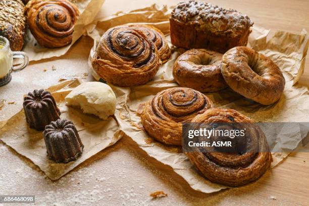 freshly baked bread on wooden table - pastry dough stock pictures, royalty-free photos & images