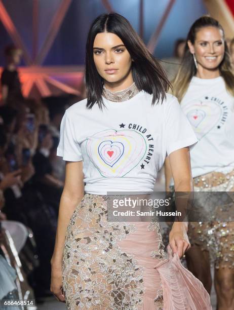 Kendall Jenner walks the runway at the Fashion for Relief event during the 70th annual Cannes Film Festival at Aeroport Cannes Mandelieu on May 21,...