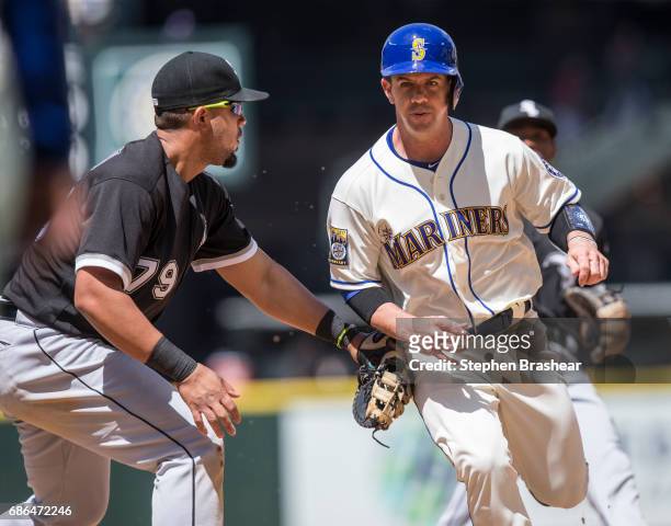 First baseman Jose Abreu of the Chicago White Sox tags out Tuffy Gosewisch of the Seattle Mariners to complete a double play on a ball hit by Jarrod...