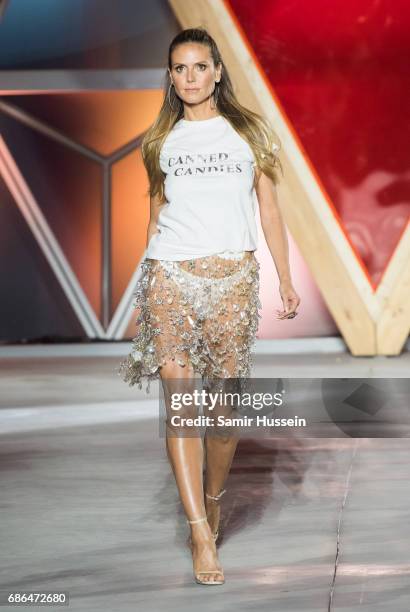 Heidi Klum walks the runway at the Fashion for Relief event during the 70th annual Cannes Film Festival at Aeroport Cannes Mandelieu on May 21, 2017...