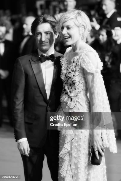 Director Noah Baumbach, actress Greta Gerwig depart after the "The Meyerowitz Stories" screening during the 70th annual Cannes Film Festival at...