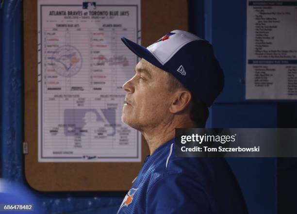 Manager John Gibbons of the Toronto Blue Jays looks on from the dugout during MLB game action against the Atlanta Braves at Rogers Centre on May 15,...