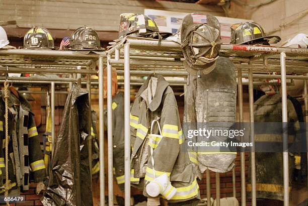Dusty firefighter gear hangs in the Ladder 10 and Engine10 firehouse November 30 which was formerly the fire station for the World Trade Center in...