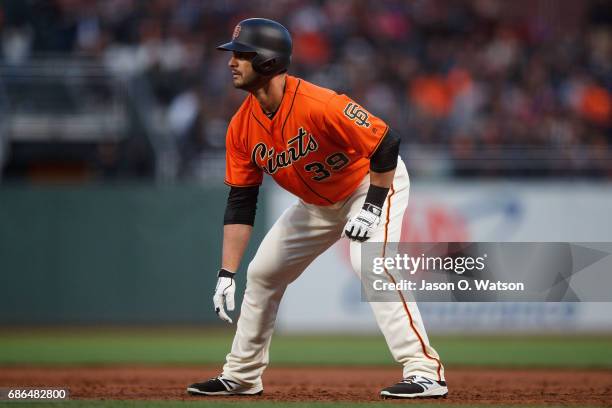 Justin Ruggiano of the San Francisco Giants leads off first base against the Cincinnati Reds during the third inning at AT&T Park on May 12, 2017 in...