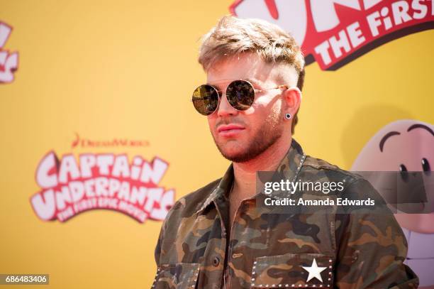 Singer Adam Lambert arrives at the premiere of 20th Century Fox's "Captain Underpants: The First Epic Movie" at the Regency Village Theatre on May...